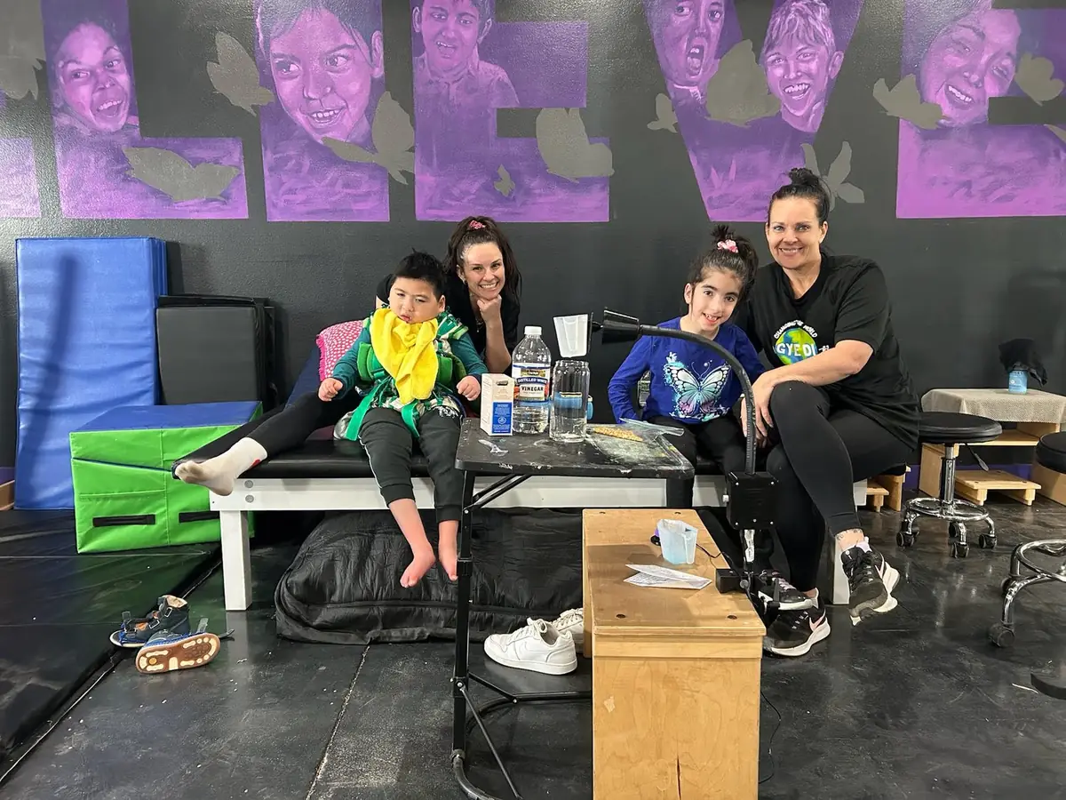 Therapists and children together in the Gye Di therapy gym